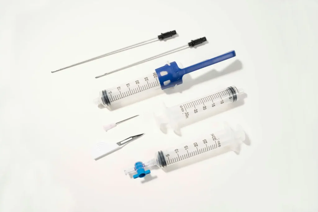 The infiltration cannula is longer and has a different hole pattern than the aspiration cannula.
